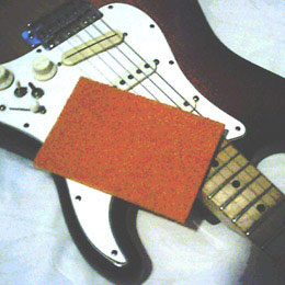 Synthetic scouring pad used for wiping guitar strings